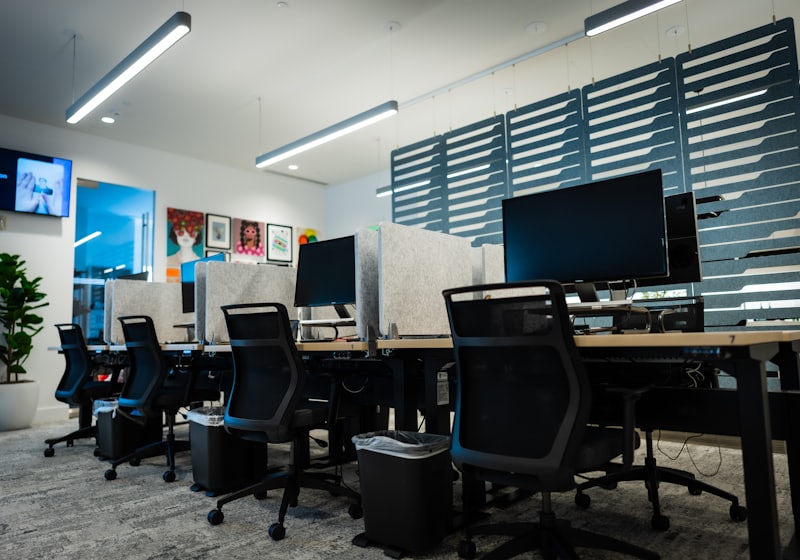 Open plan office with desks and computers